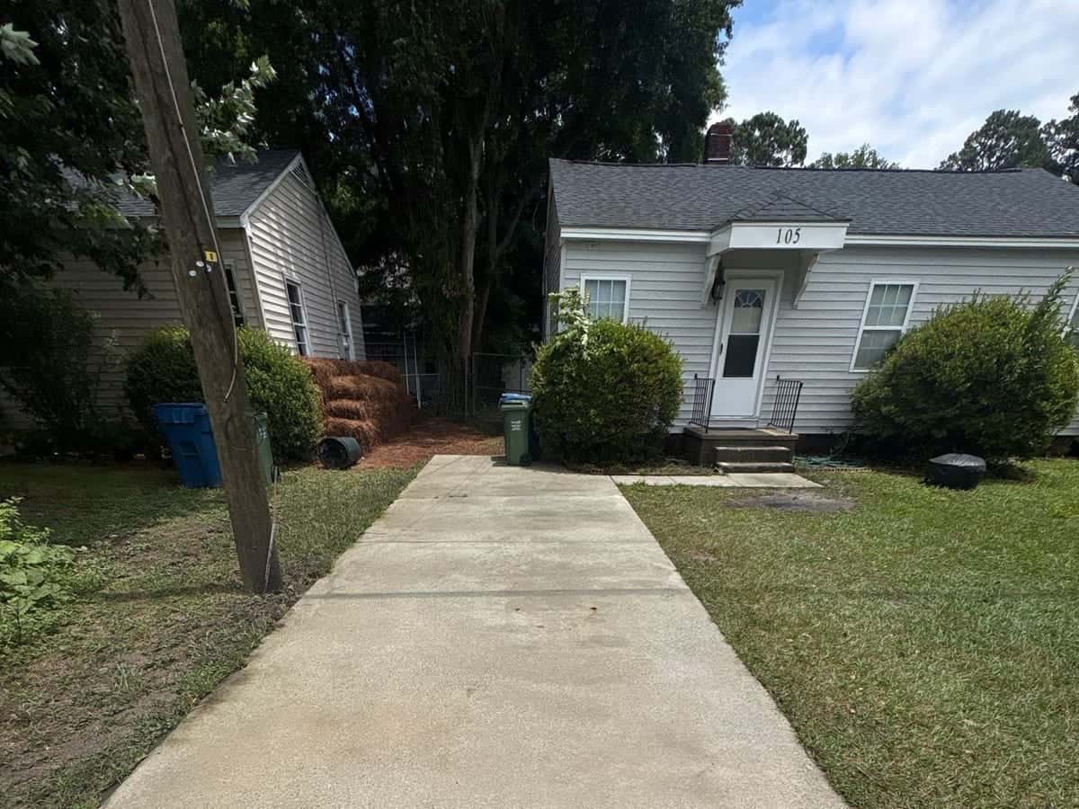 Bright, evenly cleaned concrete driveway after pressure washing in the Wilmington, NC area